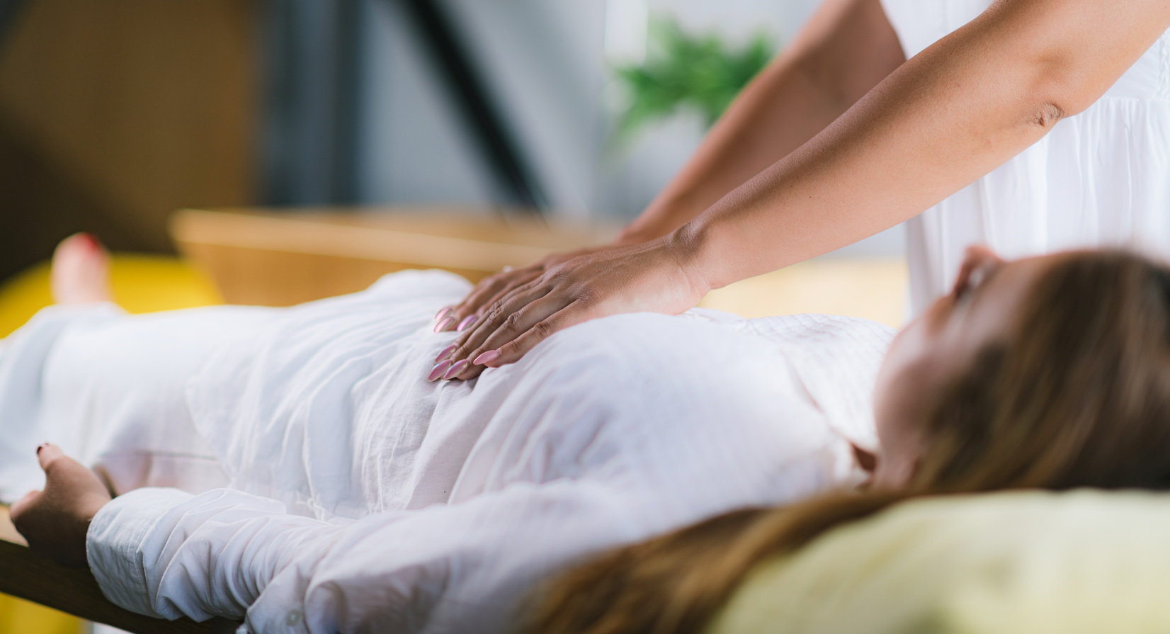 Massage Therapist Massaging Woman